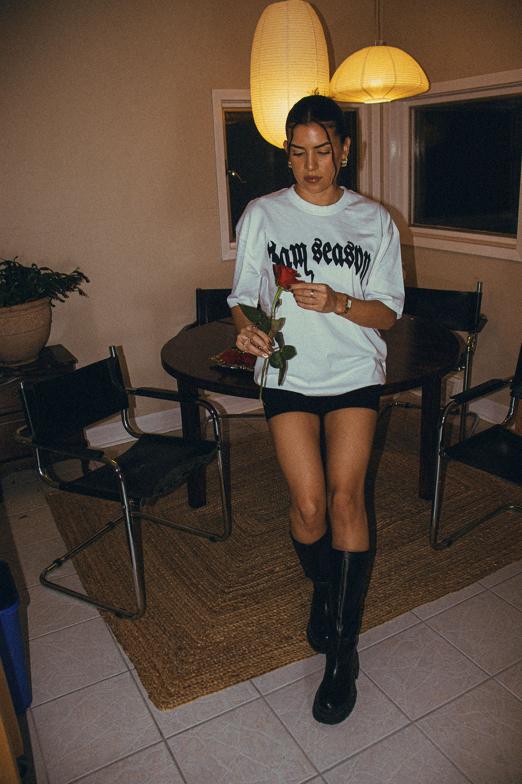 Female model wearing white 3AM Season t-shirt styled with streetwear fit
