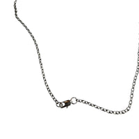 Silver chain necklace on a white background