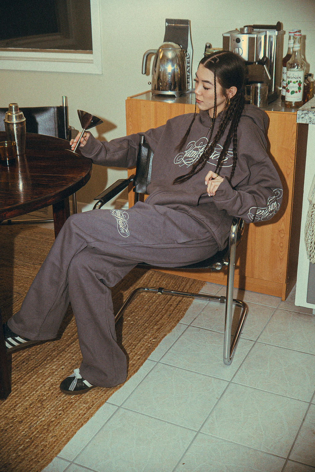 ull sweat suit worn by female model, relaxed streetwear look